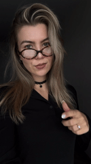 Blonde woman in glasses photographed in portrait session