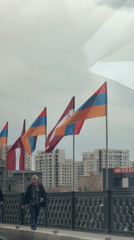 Armenian and Latvian flags wave together on Yerevan bridge