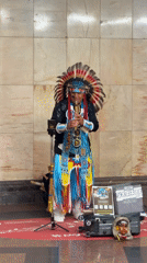 Native American regalia and flute playing on a Moscow street