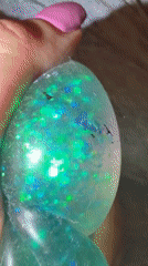 London resident filmed playing with colorful stress toys, glitter