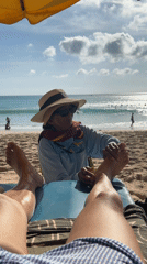 Beachside foot massage captured in Kuta Selatan, Indonesia