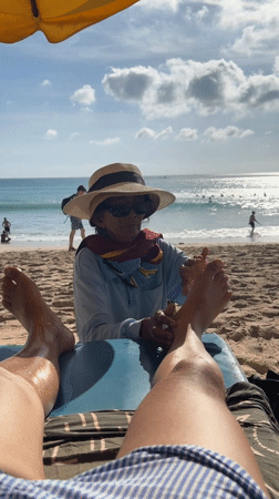 Beachside foot massage captured in Kuta Selatan, Indonesia