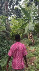 Young man films walk through rural Nigerian village