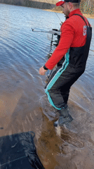 Fisherman catches and releases fish in Chaikovsky, Russia