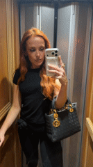 Woman takes selfie in Paris elevator on 23rd floor