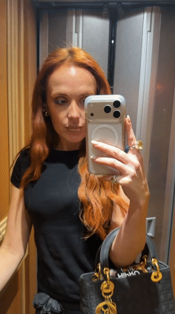 Woman takes selfie in Paris elevator on 23rd floor