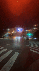 Wet nighttime street scene documented in Chuo, Japan