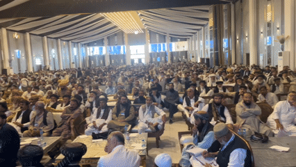 Large formal assembly in an ornate Quetta hall