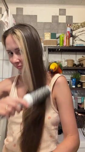 Woman's daily routine with pet parrot documented in Khimki