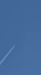 Aircraft contrails spotted over London neighborhood skies