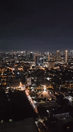 Makati's city lights spread out under a clear night sky.