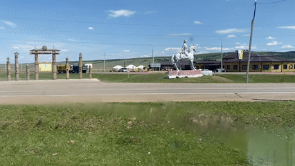 Rural Russian intersection and driver documented in Ust-Ordynsky