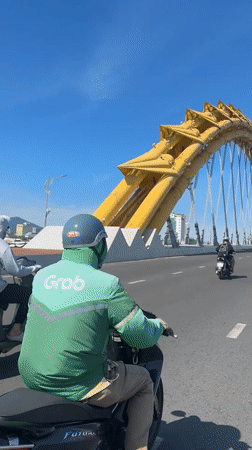 Morning street life and Dragon Bridge in central Đà Nẵng