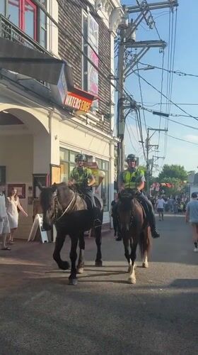 Mounted police patrol Provincetown streets on the Fourth of July