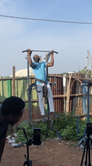 Men conduct outdoor weightlifting session in Akwanga yard