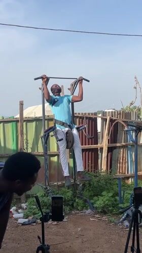 Men conduct outdoor weightlifting session in Akwanga yard