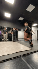 Breakdancer practices moves at Krasnoyarsk studio with audience watching