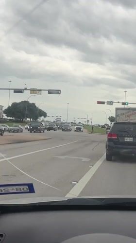 Driver records busy Arlington intersection with Sysco truck present