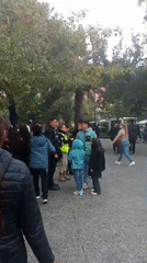 Evening crowd gathers in Santiago public square near statue