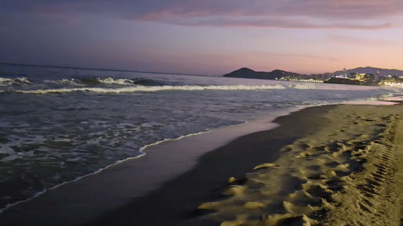Evening beachfront leisure documented in Benidorm, Spain