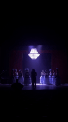 Theatrical performance with period costumes captured on stage
