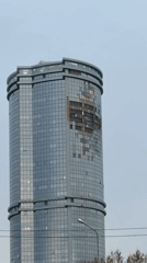 Glass tower observed under overcast skies in Kazan