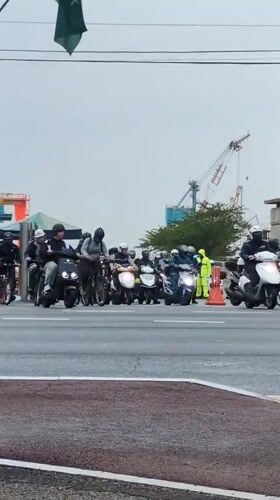 Morning cyclists and scooter riders share Ulsan street