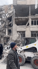 Building collapse documented in Tehran with extensive structural damage