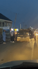 Car breaks down on Nigerian street, draws small crowd
