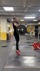 Weightlifter performs barbell snatch at Blagoveshchensk gym