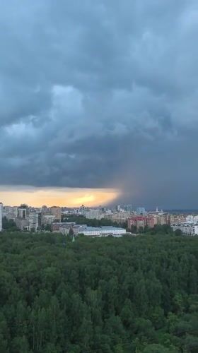 Storm views across Perm with cat break indoors