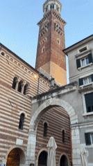 Outdoor dining and crowds fill a Verona piazza