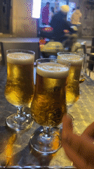 Evening drinks and laughter captured at Barcelona outdoor table