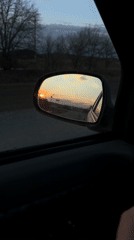 Vehicle travels Russian road at sunset near Rusalevka