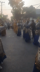 Traditional parade winds through Patokan streets with costumed performers