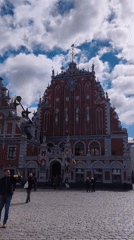 Street music, sculptures, and plaza life in Riga's Old Town