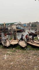 Daily commerce and labor activity along Dhaka waterfront
