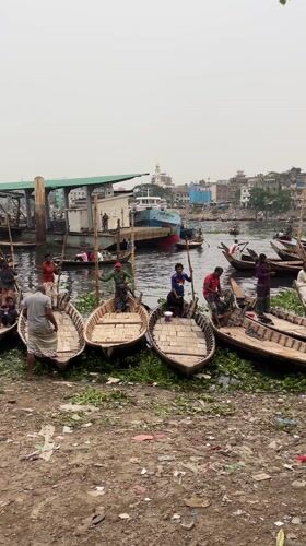 Daily commerce and labor activity along Dhaka waterfront
