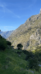 Tourist documents scenic mountain views in Kotor, Montenegro