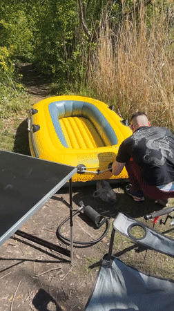 Angler prepares inflatable raft for fishing trip in Mittenwalde