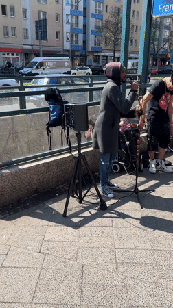 Street musicians perform in Berlin amid local retail activity
