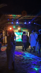 Beach party with stage lights draws dancers in Maldives