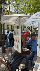Street artist spotted working in Montmartre district, Paris