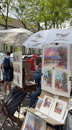 Street artist spotted working in Montmartre district, Paris