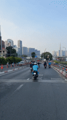 Street scene captured from moving vehicle in Thủ Đức