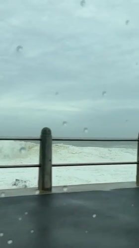 Rainy weather documented in Cape Town with stormy seas
