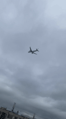 Commercial plane descends through clouds over Sofia airport