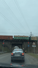 Family waits at railroad crossing in Froly, Russia