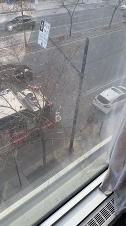 Police activity observed from Montreal window during evening hours