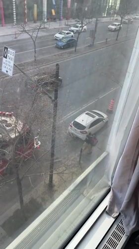 Police activity observed from Montreal window during evening hours